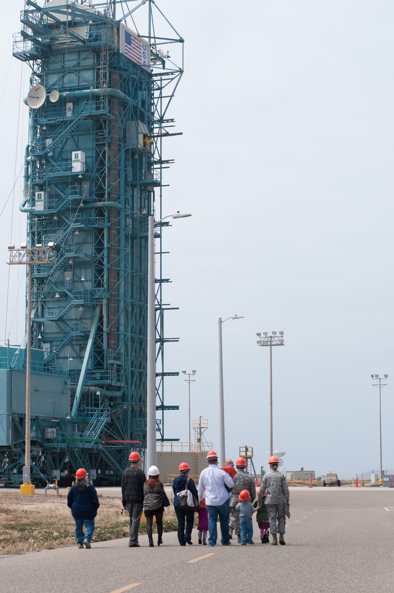 1st Lt. Matthew LeSaint, 4th Space Launch Squadron deputy chief engineer, educates Team V members and their families on the 30th Launch Group mission during the “Space Walk” tour of Space Launch Complex 2, May 8, 2015, Vandenberg Air Force Base, Calif. (U.S. Air Force Photo by Michael Peterson/Released)