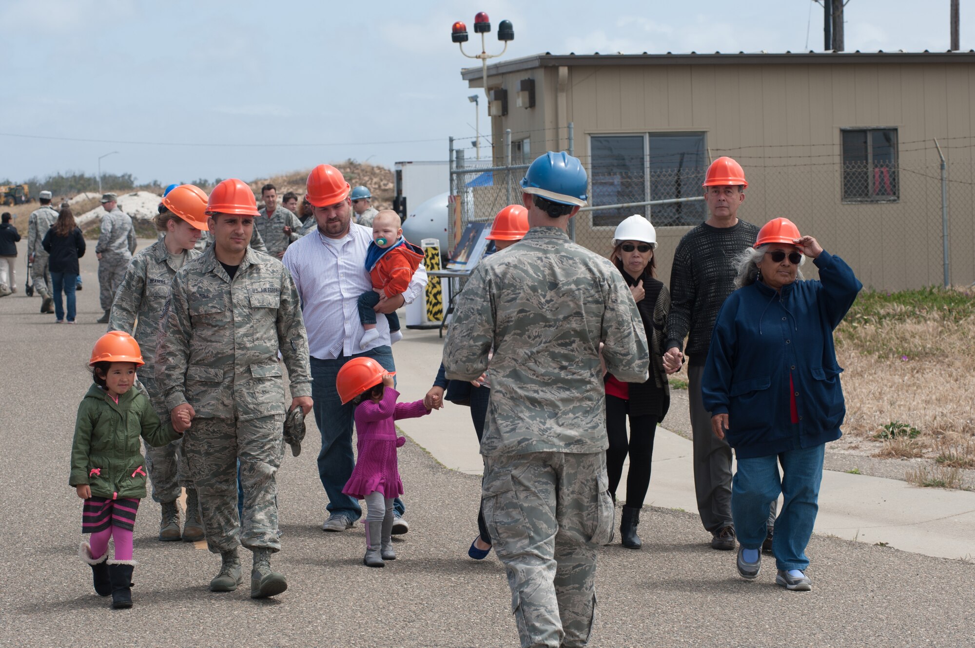 1st Lt. Matthew LeSaint, 4th Space Launch Squadron deputy chief engineer, educates Team V members and their families on the 30th Launch Group mission during the “Space Walk” tour of Space Launch Complex 2, May 8, 2015, Vandenberg Air Force Base, Calif. (U.S. Air Force Photo by Michael Peterson/Released)