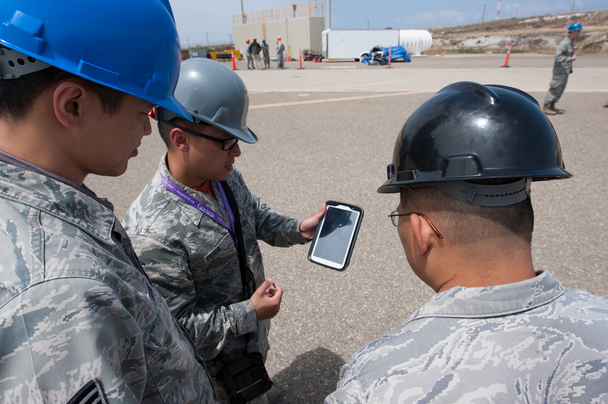 Tech. Sgt. Gerald Peria, 4th Space Launch Squadron mission assurance technician, educates Team V members about the history and mission of Space Launch Complex 2 during the “Space Walk” tour of the facility, May 8, 2015, Vandenberg Air Force Base, Calif. (U.S. Air Force Photo by Michael Peterson/Released)