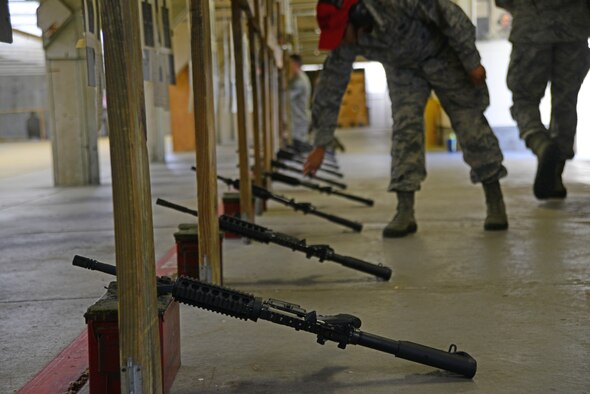 M4 carbines set in the ready position during a rifle shooting competition, May 12, 2015, at McConnell Air Force Base, Kan. The competition was hosted by the 22nd Security Forces Squadron to recognize the National Police Week and highlight the importance of law enforcement in the community. (U.S. Air Force photos by Airman 1st Class Christopher Thornbury)
