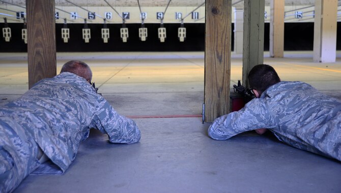 Airmen fire M4 carbines during a rifle shooting competition, May 12, 2015, at McConnell Air Force Base, Kan. The competition was hosted by the 22nd Security Forces Squadron to recognize the National Police Week and highlight the importance of law enforcement in the community. (U.S. Air Force photos by Airman 1st Class Christopher Thornbury)