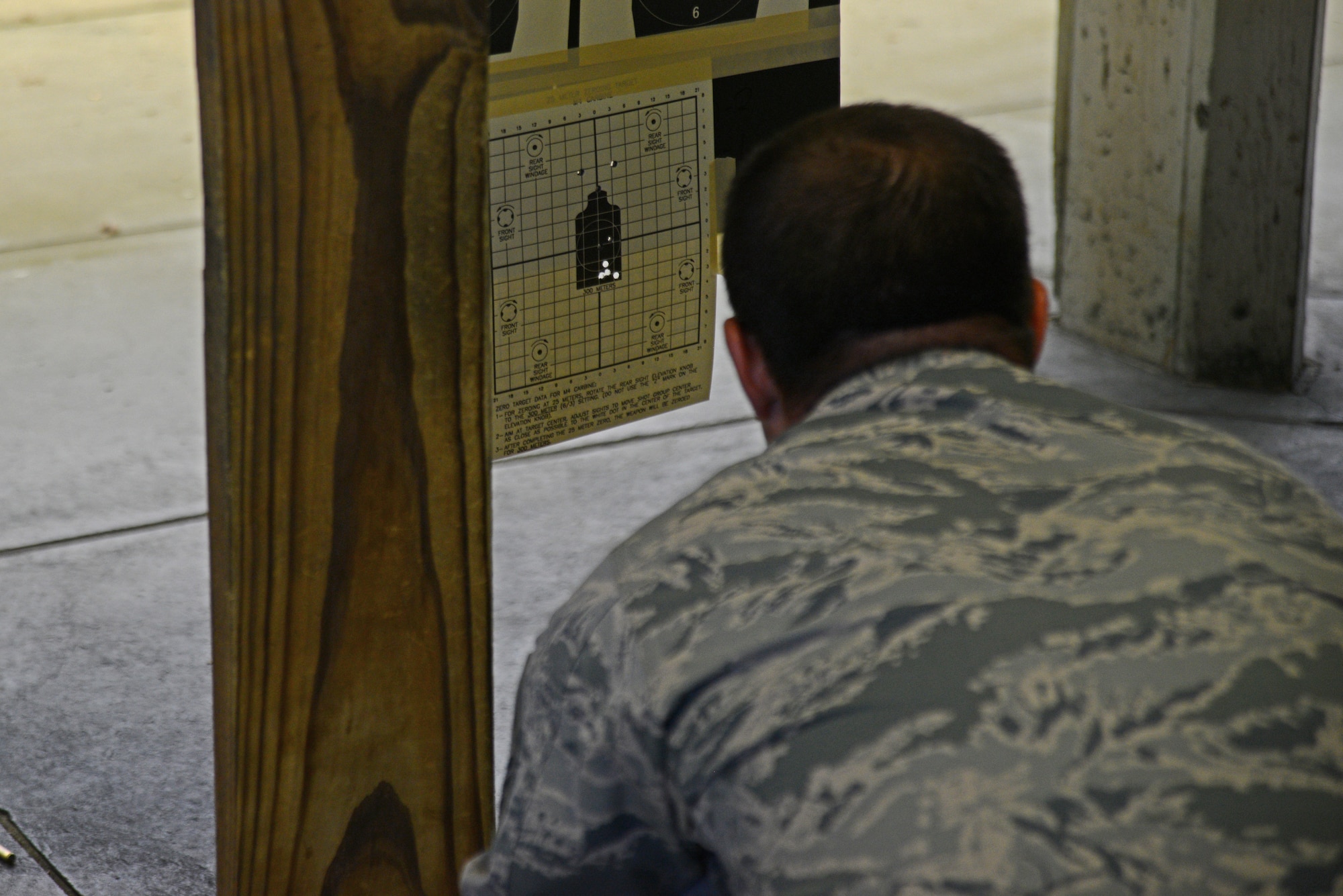 Master Sgt. Edward Musterer, 22nd Maintenance Group quality assurance chief inspector, checks his target after firing an M4 carbine during a rifle shooting competition, May 12, 2015, at McConnell Air Force Base, Kan. The competition was hosted by the 22nd SFS to recognize National Police Week and highlight the importance of law enforcement in the community and helped build camaraderie. (U.S. Air Force photo by Airman 1st Class Christopher Thornbury)