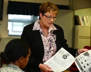 Sheila Pankoke, McDonald Army Health Center Preventive Medicine Community Health nurse, discusses the different ways Preventive Medicine Community Health staff can assist U.S. Service members at Fort Eustis, Va., May 11, 2015. Pankoke provides in-processing briefings, HIV/AIDS awareness classes and immunizations for the U.S. Army Soldiers assigned to Fort Eustis.This year’s National Nurses Week theme is, “Ethical practice. Quality care.” (U.S. Air Force photo by Senior Airman Kimberly Nagle/Released)  
