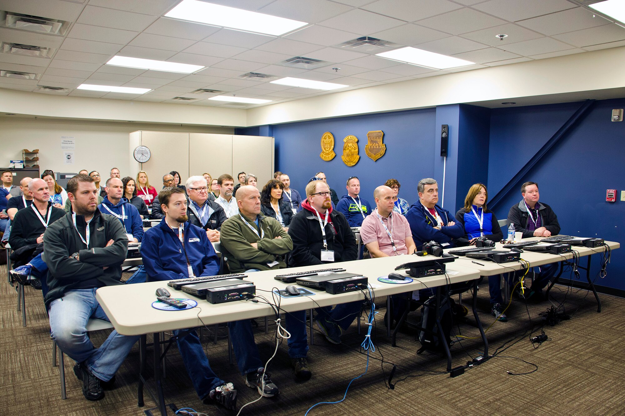 Employers participating in Employer Orientation Day sit through a brief on Joint Base Lewis-McChord, Wash., May 2. The purpose of EOD was to strengthen the reservist-employer relationship by providing employers a better understanding of their Airmen’s military missions and obligations. (U.S. Army photos by Sgt. Jasmine Higgins)