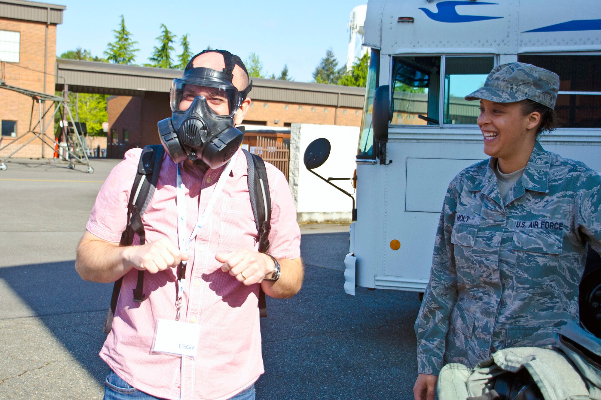 An employer participating in Employer Orientation Day gets first-hand experience on how to properly wear a gas mask in Joint Base Lewis-McChord, Wash., May 2. The employers also got demonstrations with explosive ordinance disposal techniques and equipment, and security forces.  (U.S. Army photos by Sgt. Jasmine Higgins)