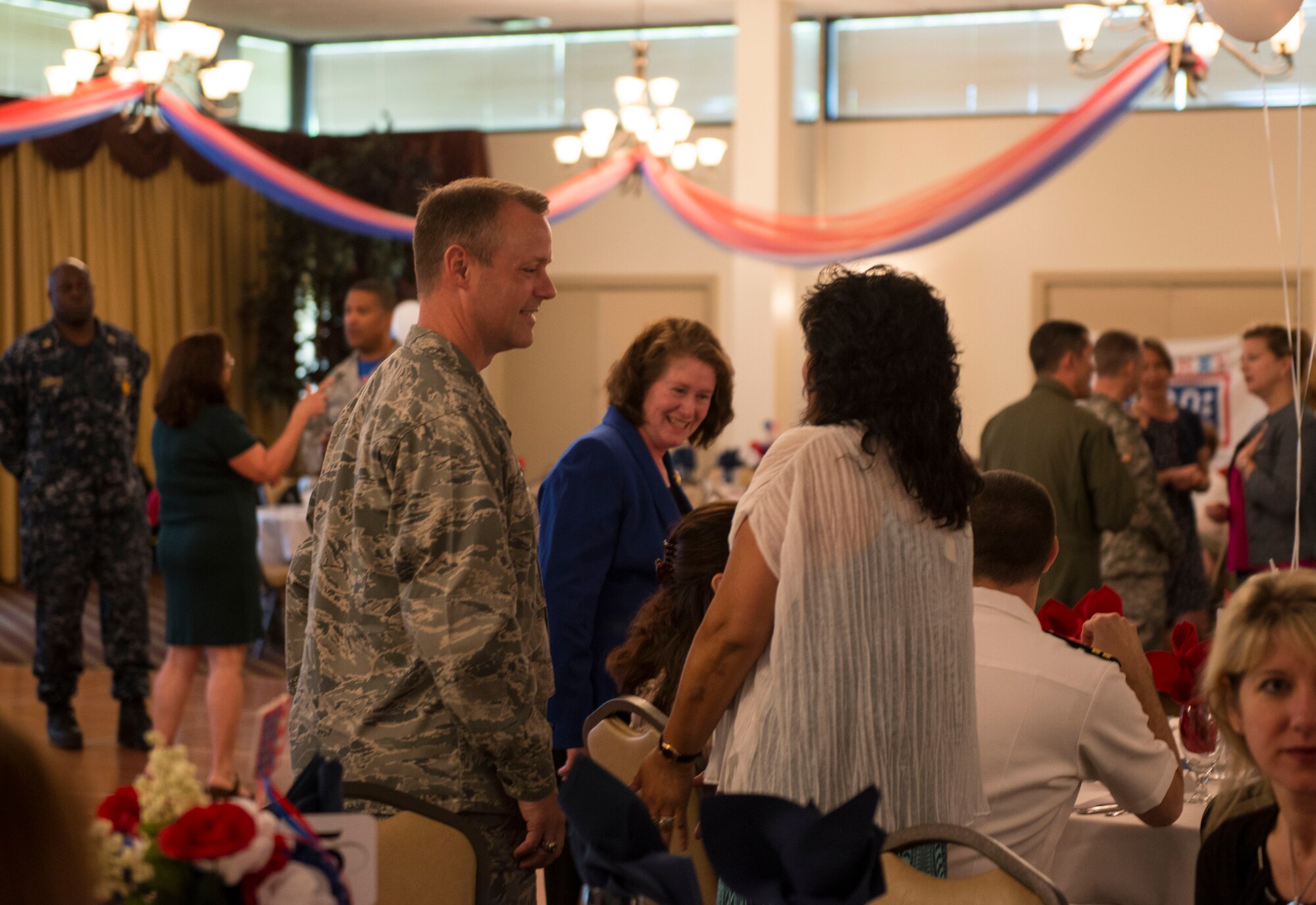 Col. James Hodges, Joint Base McGuire-Dix-Lakehurst commander, speaks with spouses at the annual Spouse Appreciation Day Luncheon on JB MDL, N.J. May 8, 2015. The luncheon gave an opportunity for services members to express gratitude for sacrifices made by their spouses. (U.S. Air Force photo by Airman 1st Class Joshua King)