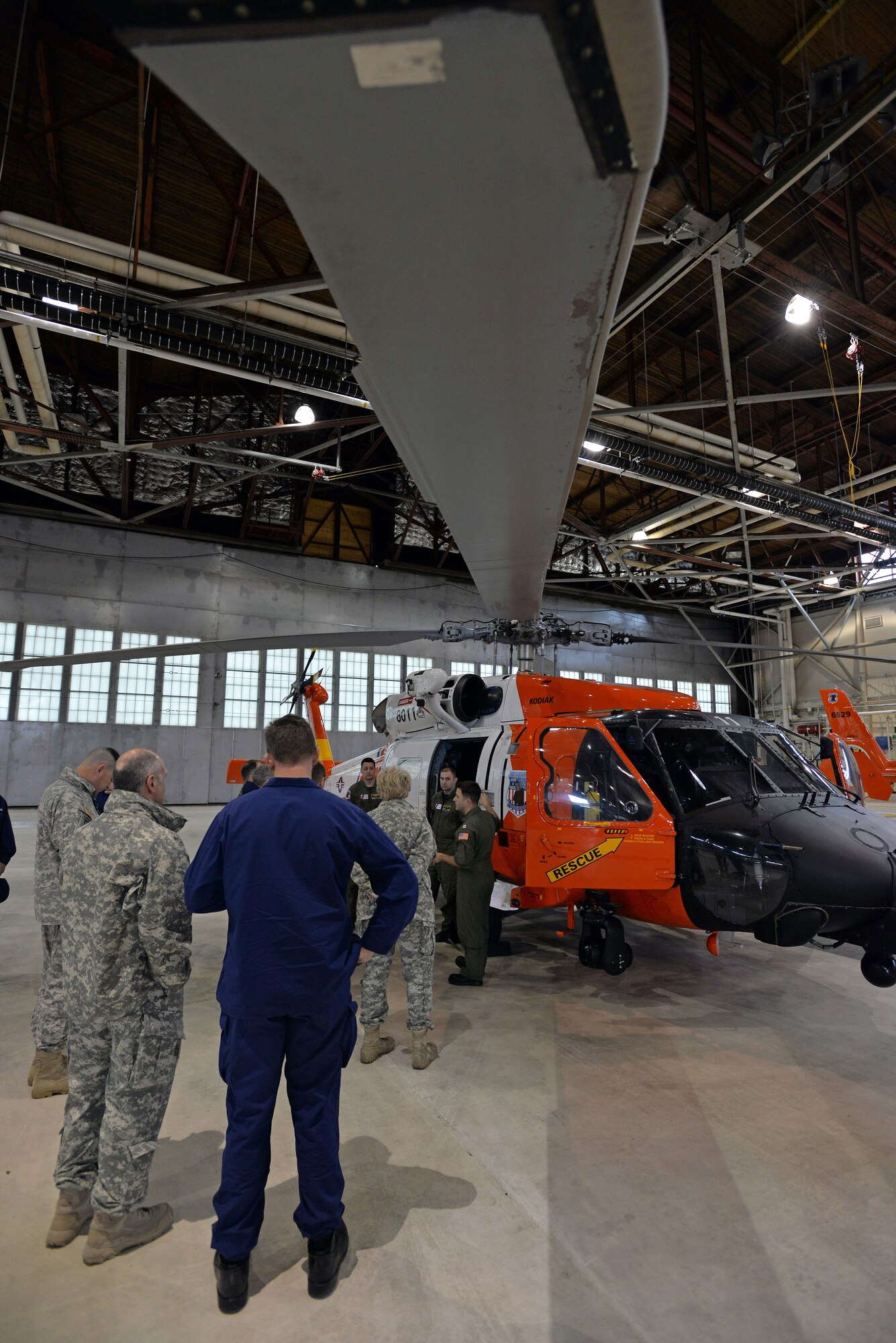 COAST GUARD BASE KODIAK, Alaska —Arctic General Officer/Flag Officer Conference attendees learn about the capabilities of the Coast Guard UH60 Jayhawk helicopters April 30. Alaskan Command and U.S. Coast Guard’s District 17 hosted the Arctic GO/FO Conference April 29 – May 1, which included flag officers from the U.S. Air Force, U.S. Army, U.S. Coast Guard, Alaska National Guard and Canadian Forces, to strengthen partnerships, discuss future Arctic and Alaskan challenges and joint capabilities. (U.S. Air Force photo/Tech. Sgt. John Gordinier)