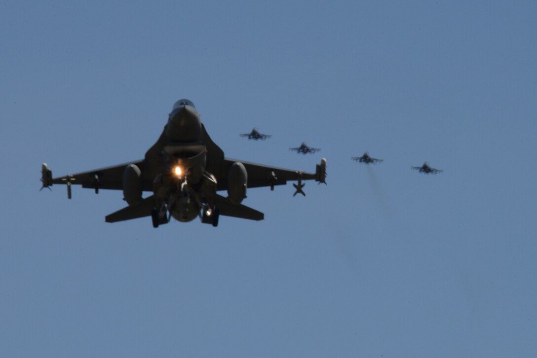 A U.S. Air Force F-16 Fighting Falcon assigned to the 13th Fighter Squadron, Misawa Air Base, Japan, prepares to land ahead of four other Misawa F-16s May 11, 2015, after a sortie during RED FLAG-Alaska (RF-A) 15-2 at Eielson Air Force Base, Alaska. RF-A allows participating units to exchange tactics, techniques and procedures as well as improve interoperability. (U.S. Air Force photo by Senior Airman Ashley Nicole Taylor/Released)
