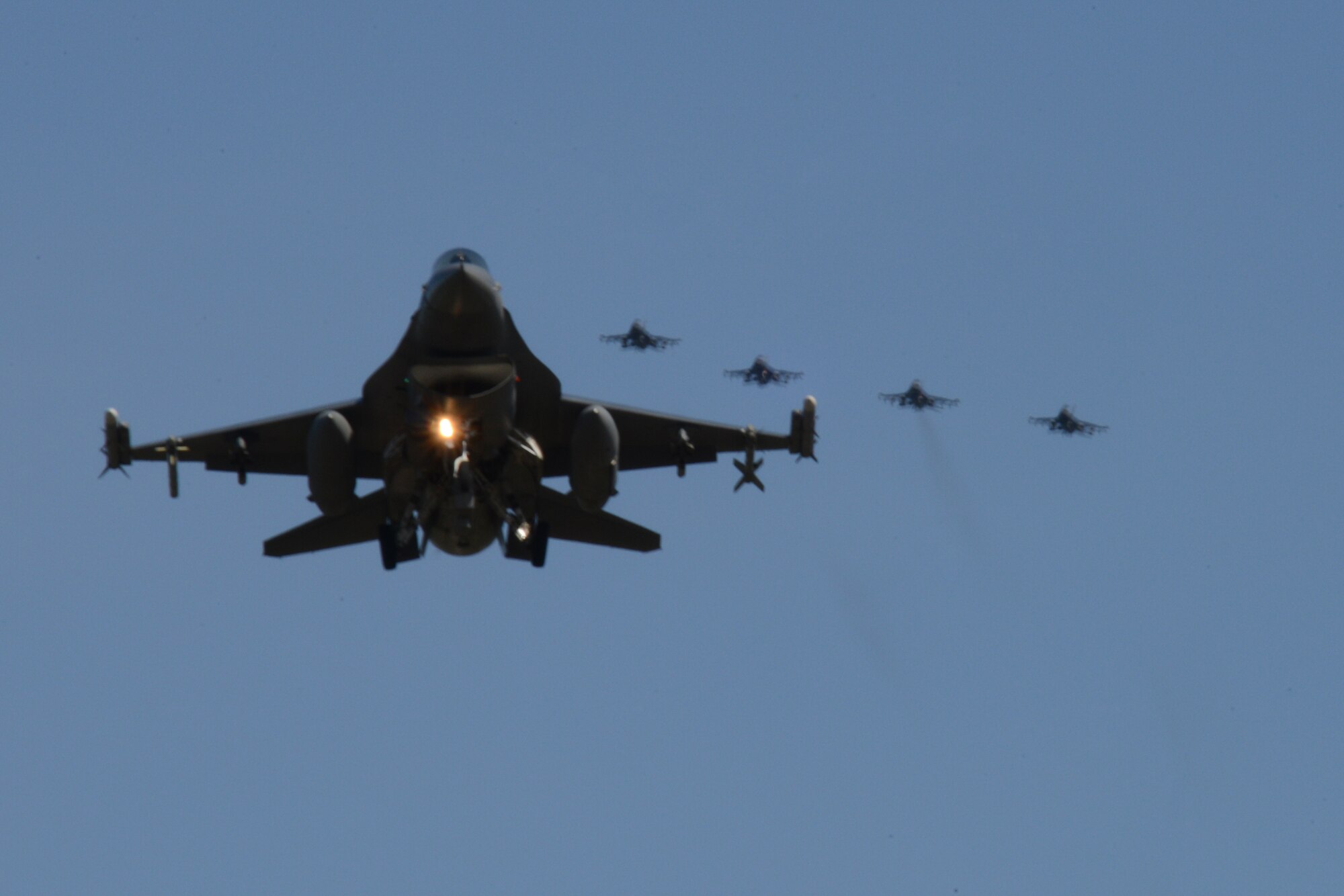 A U.S. Air Force F-16 Fighting Falcon assigned to the 13th Fighter Squadron, Misawa Air Base, Japan, prepares to land ahead of four other Misawa F-16s May 11, 2015, after a sortie during RED FLAG-Alaska (RF-A) 15-2 at Eielson Air Force Base, Alaska. RF-A allows participating units to exchange tactics, techniques and procedures as well as improve interoperability. (U.S. Air Force photo by Senior Airman Ashley Nicole Taylor/Released)
