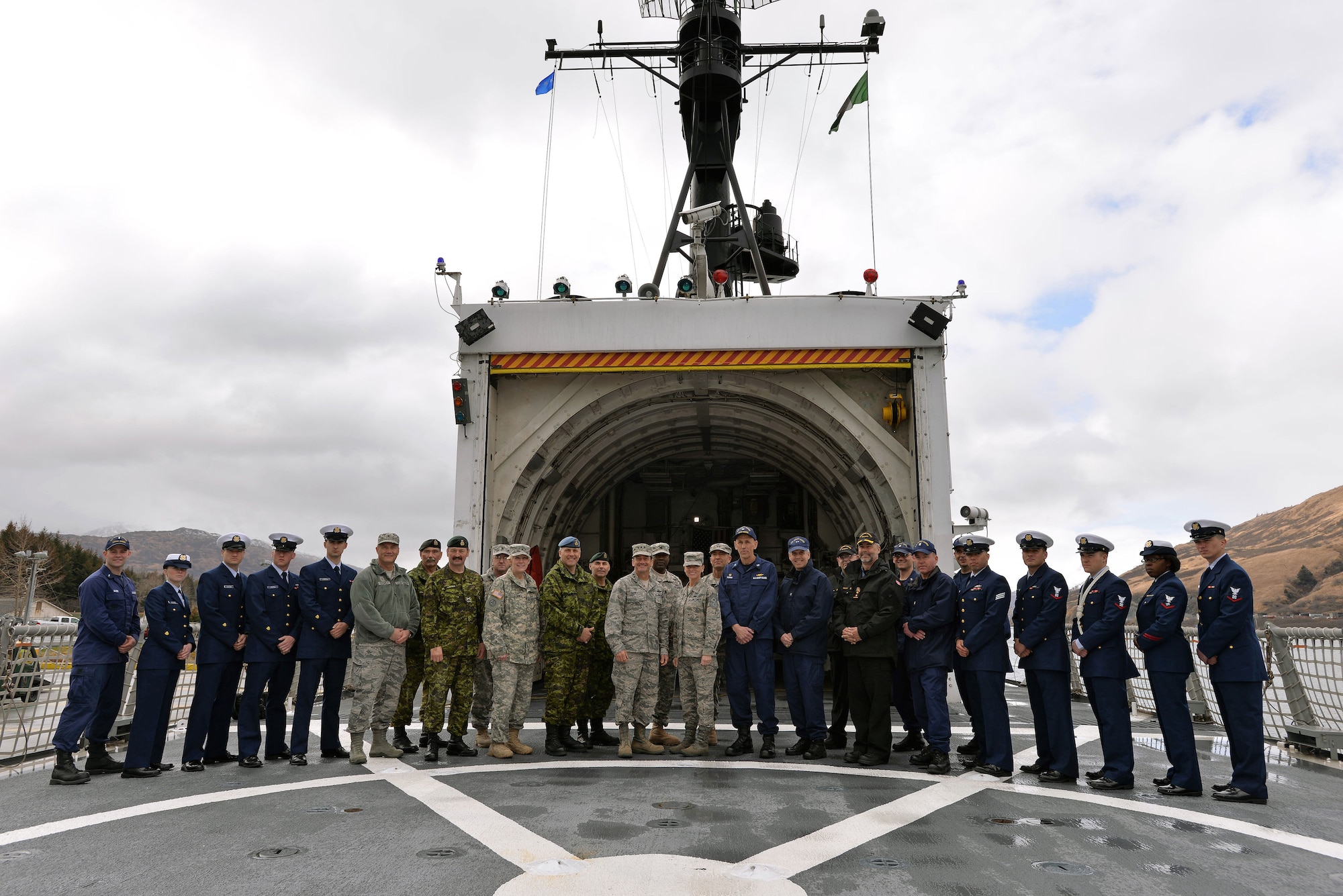 COAST GUARD BASE KODIAK, Alaska —Arctic General Officer/Flag Officer Conference attendees pose for a photo with Coast Guardsmen on the USCG Cutter MUNRO April 30. Alaskan Command and U.S. Coast Guard’s District 17 hosted the Arctic GO/FO Conference April 29 – May 1, which included flag officers from the U.S. Air Force, U.S. Army, U.S. Coast Guard, Alaska National Guard and Canadian Forces, to strengthen partnerships, discuss future Arctic and Alaskan challenges and joint capabilities. (U.S. Air Force photo/Tech. Sgt. John Gordinier)