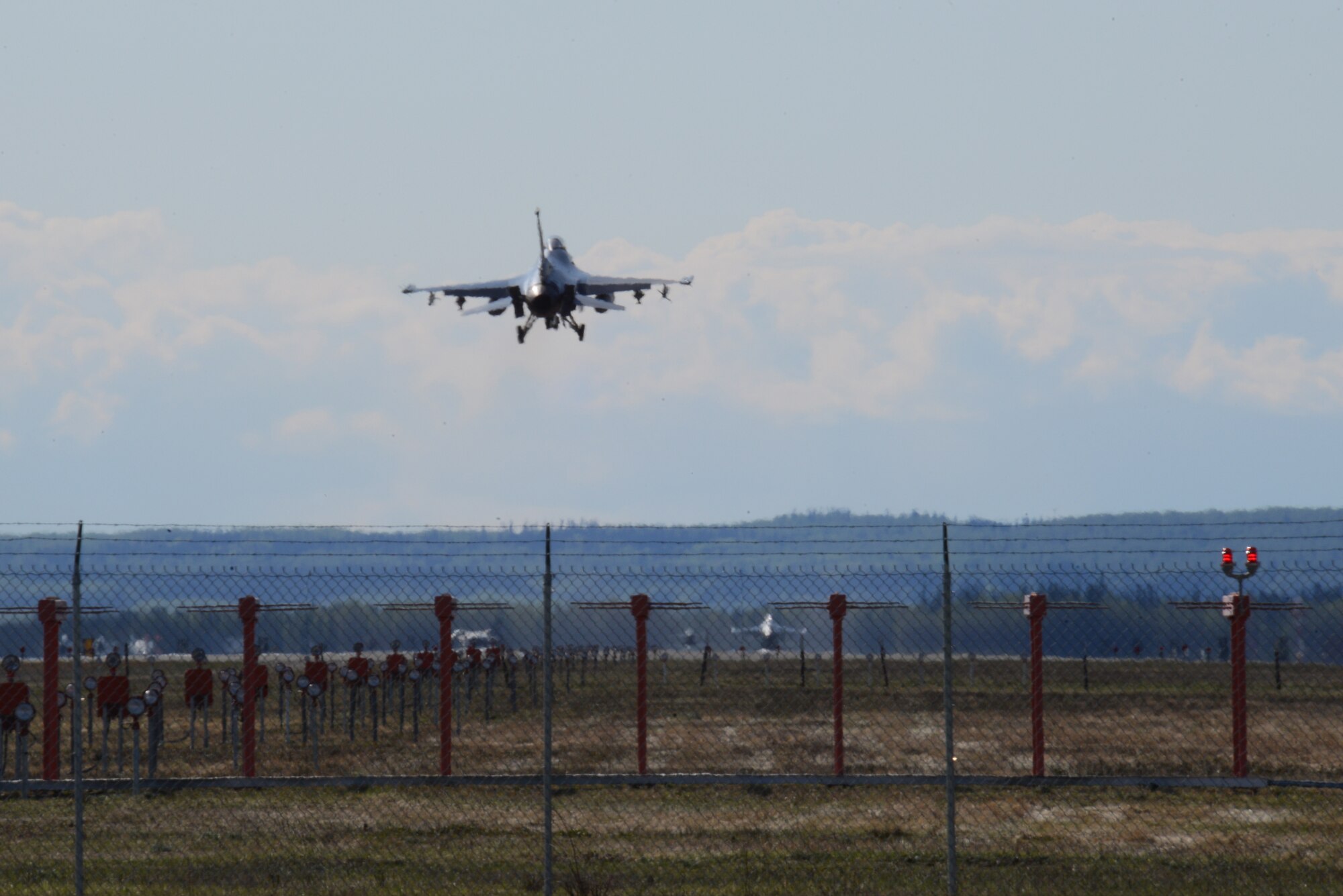 A U.S. Air Force F-16 Fighting Falcon aircraft assigned to the 113th Wing, District of Columbia Air National Guard, prepares to land May 11, 2015, after a sortie during RED FLAG-Alaska (RF-A) 15-2 at Eielson Air Force Base, Alaska. RF-A enables joint and international units to sharpen their combat skills by flying simulated combat sorties in a realistic threat environment. (U.S. Air Force photo by Senior Airman Ashley Nicole Taylor/Released)
