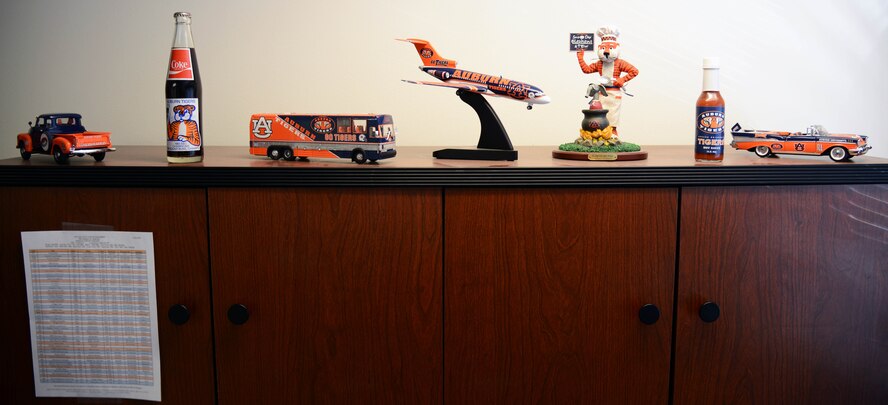 Various mementos from Auburn University, Alabama, adorn the desk of Master Sgt. Jason Whitehead, 341st Security Forces Squadron first sergeant, May 5, 2015, at Malmstrom Air Force Base, Mont. This touch of personalization breathes life into what would be an ordinary office, making it a more welcome place for Airmen to come talk to him. (U.S. Air Force photo/ Airman 1st Class Dillon Johnston)