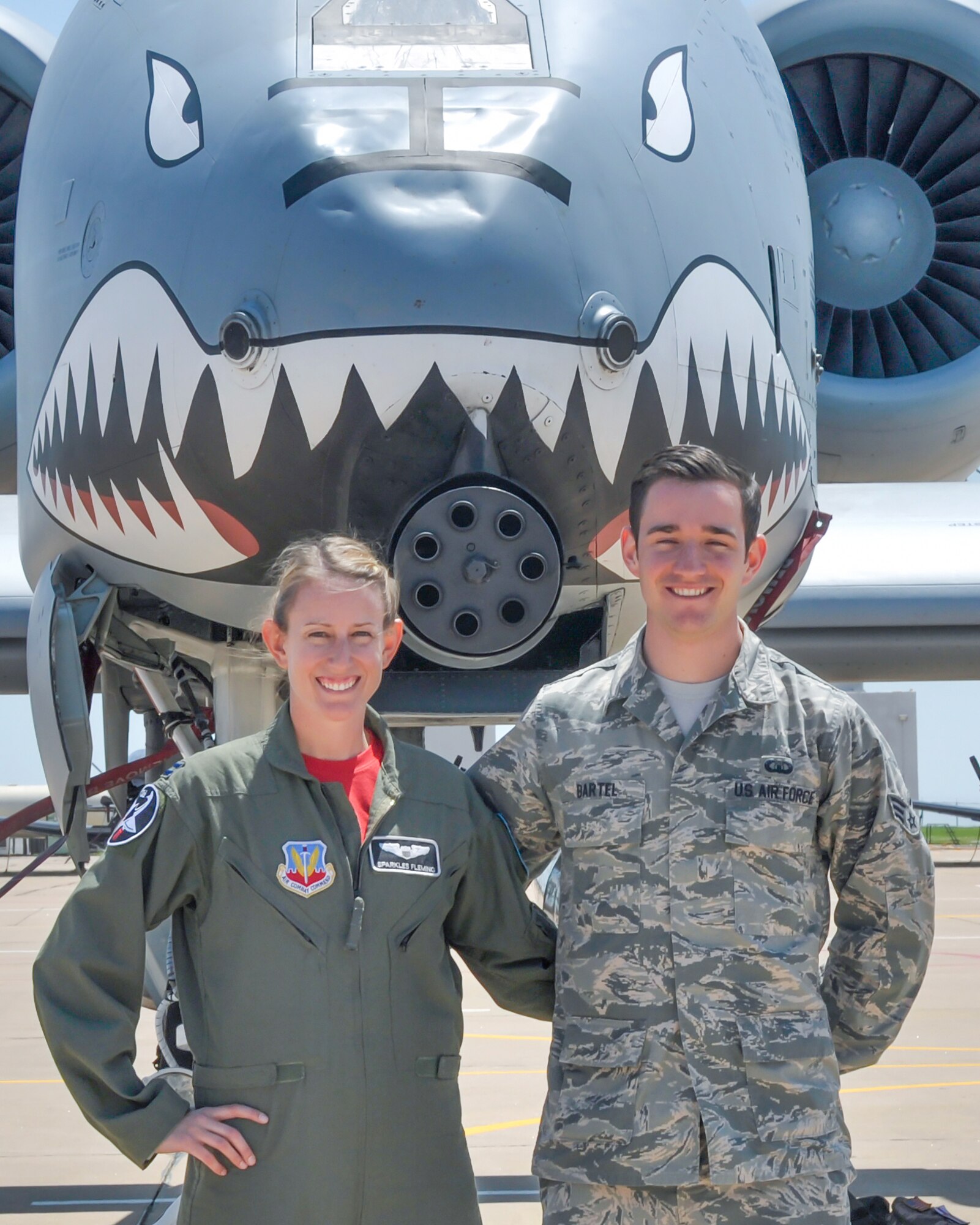 Capt. Chandra Fleming, a 75th Fighter Squadron A-10 Thunderbolt II pilot flying out of Moody Air Force Base, Georgia, and her brother, Senior Airman Michael Bartel, a 71st Operation Support Squadron air traffic controller, share a moment in front of Fleming’s A-10 at Vance Air Force Base, Oklahoma, May 1. The previous afternoon, Bartel, a 71st Operations Support Squadron air traffic controller stationed at Vance, directed his sister into local airspace and gave her approach clearance. (U.S. Air Force photo / 2nd Lt. Isabel Crump)