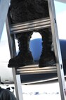 Senior Airman Kasey Castor, 5th Maintenance Group weapons load crew team member, climbs a ladder on Minot Air Force Base, N.D., Jan. 30, 2015. Castor performed maintenance on a section of the B-52H Stratofortress with her team members. (U.S. Air Force photo/Senior Airman Malia Jenkins)
