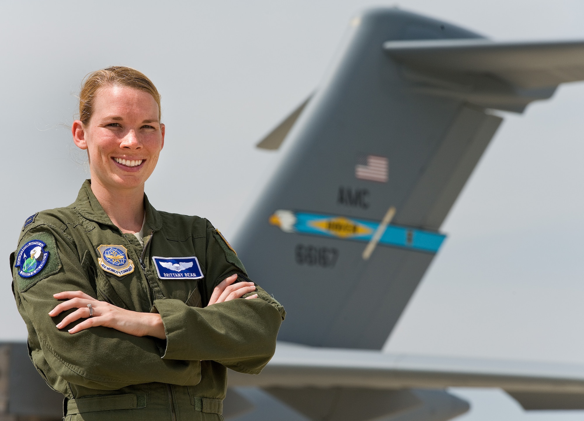 Capt. Brittany Bean, 436th Operations Support Squadron executive officer, poses in front of a C-17 Globemaster III May 8, 2015, at Dover Air Force Base, Del.  Bean was in the middle of travelling throughout the country of Nepal when a devastating 7.8 magnitude earthquake struck in April. (U.S. Air Force photo/Roland Balik)