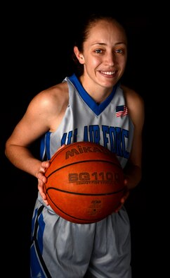 U.S. Air Force 2nd Lt. Micah Wessinger, 20th Logistics Readiness Squadron installation deployment officer, led the United States Armed Forces Women’s Basketball Team to a gold medal during the Headquarter AirCom Inter-Nation Basketball Tournament held at Royal Air Force Lakenheath, England, March 24-27, 2015. Wessinger was named the Most Valuable Player of the tournament after leading the U.S. to a victory over Germany, 90-89. (U.S. Air Force photo by Senior Airman Jensen Stidham/Released)