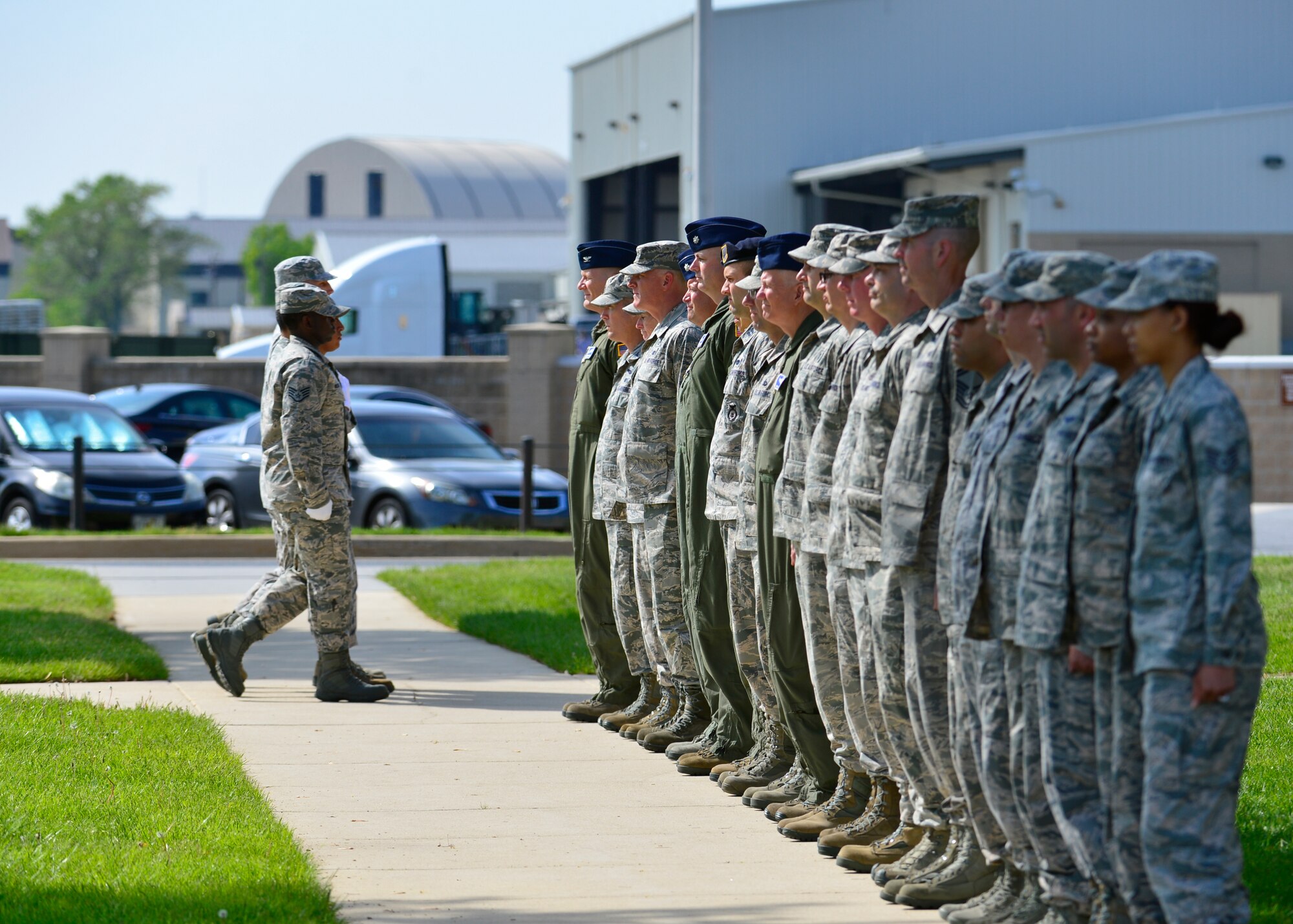 A security flag detail from the 436th Civil Engineer Squadrons marches past senior leadership to secure the flag during a retreat ceremony May 8, 2015, at Dover Air Force Base, Del.  The first retreat ceremony of the year was conducted by the 436th CES and was attended by Col. Michael Grismer, 436th Airlift Wing commander, and Chief Master Sgt. Stanley Cadell, 436th AW command chief. (U.S. Air Force photo/Airman 1st Class William Johnson)