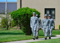 Airman 1st Class Bryce Hesselbacher, front left, Staff Sgt. Leopoldo Lardizabal, front right, Staff Sgt. Kareem Wilson, back left, and Senior Airman Alex Ventura, back right, march out to the base flag pole during a retreat ceremony May 8, 2015, at Dover Air Force Base, Del. The security flag detail was from the 436th Civil Engineer Squadron. (U.S. Air Force photo/Airman 1st Class William Johnson)
