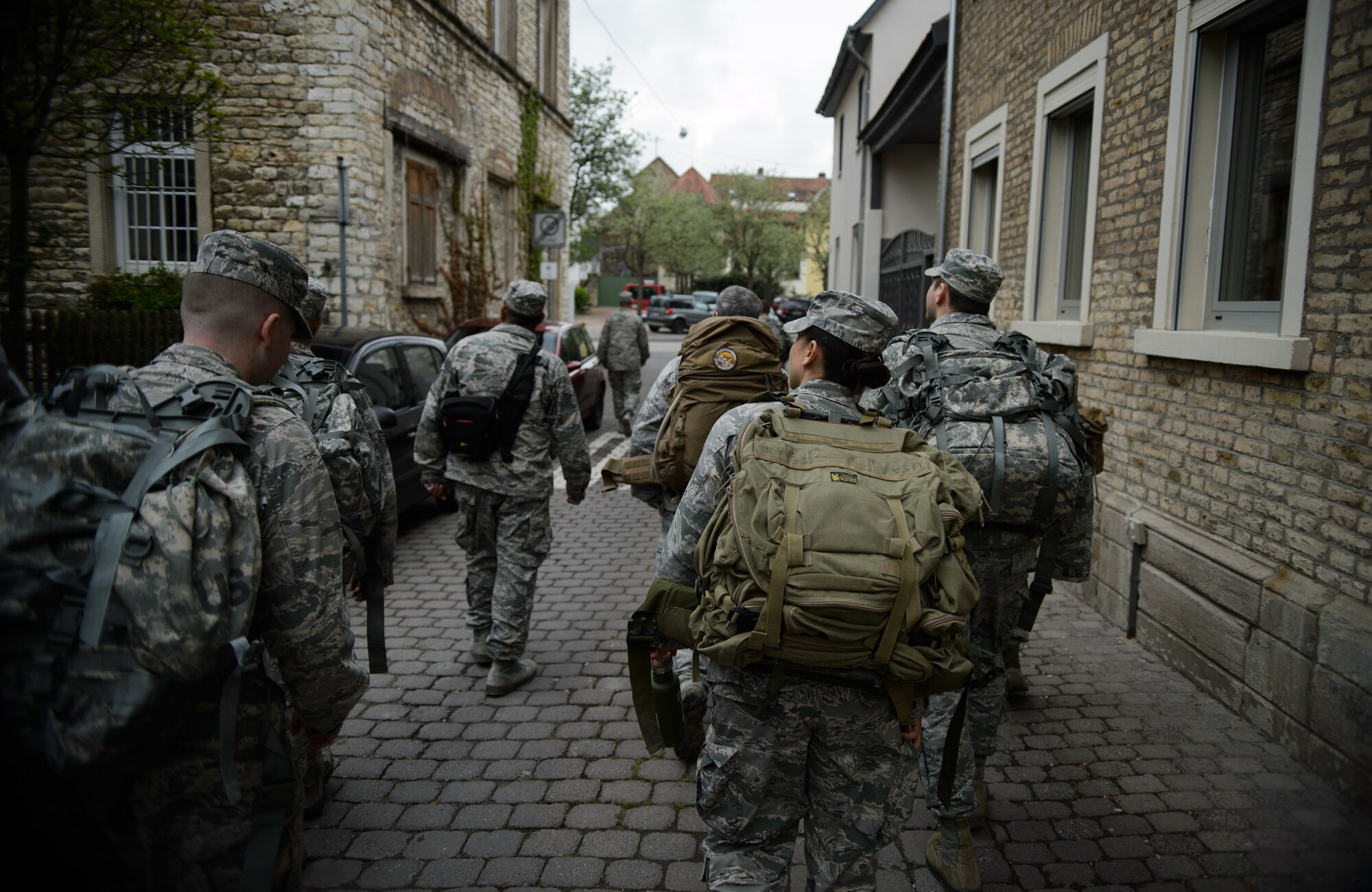 Members of the 4th Air Support Operations Group return home after completing a 12-kilometer ruck march May 1, 2015, at Undenheim, Germany. The Airmen worked alongside the Rhineland-Pflaz Reservist Chapter Undenheim to complete one of the many tasks required to earn a German Armed Forces Badge for Military Proficiency. (U.S. Air Force photo/Staff Sgt. Armando A. Schwier-Morales)