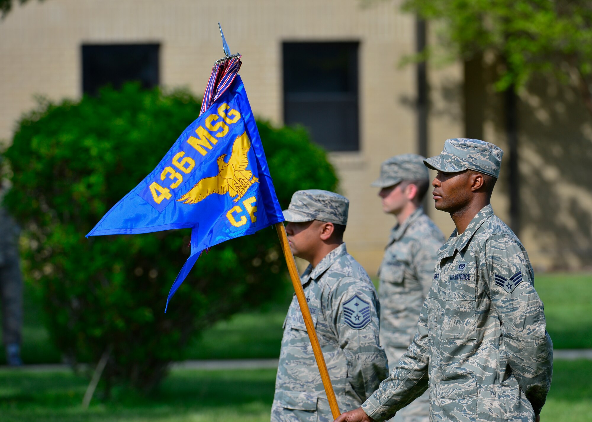 Senior Airman Andrew Wright, 436th Civil Engineer Squadron electrical systems journeyman, stands at parade rest with 436th CES guidon during the retreat ceremony May 8, 2015, at Dover Air Force Base, Del. The 436th CES was selected to perform the first retreat ceremony of the year. (U.S. Air Force photo/Airman 1st Class William Johnson)