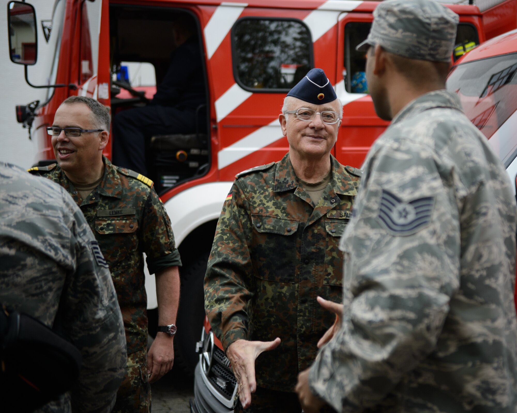 Cmdr. Juergen Lemke, Rhineland-Pfalz Reservist Chapter Undenheim chairman, left, and Col. Michael Sauer, Rhineland-Pfalz Reservist chairman, shake hands with 4th Air Support Operations Group Airmen as they depart May 1, 2015, at Undenheim, Germany. Lemke and Sauer hosted U.S. Airmen for a 12-kilometer ruck march, bringing both U.S. and German service members together. (U.S. Air Force photo/Staff Sgt. Armando A. Schwier-Morales)