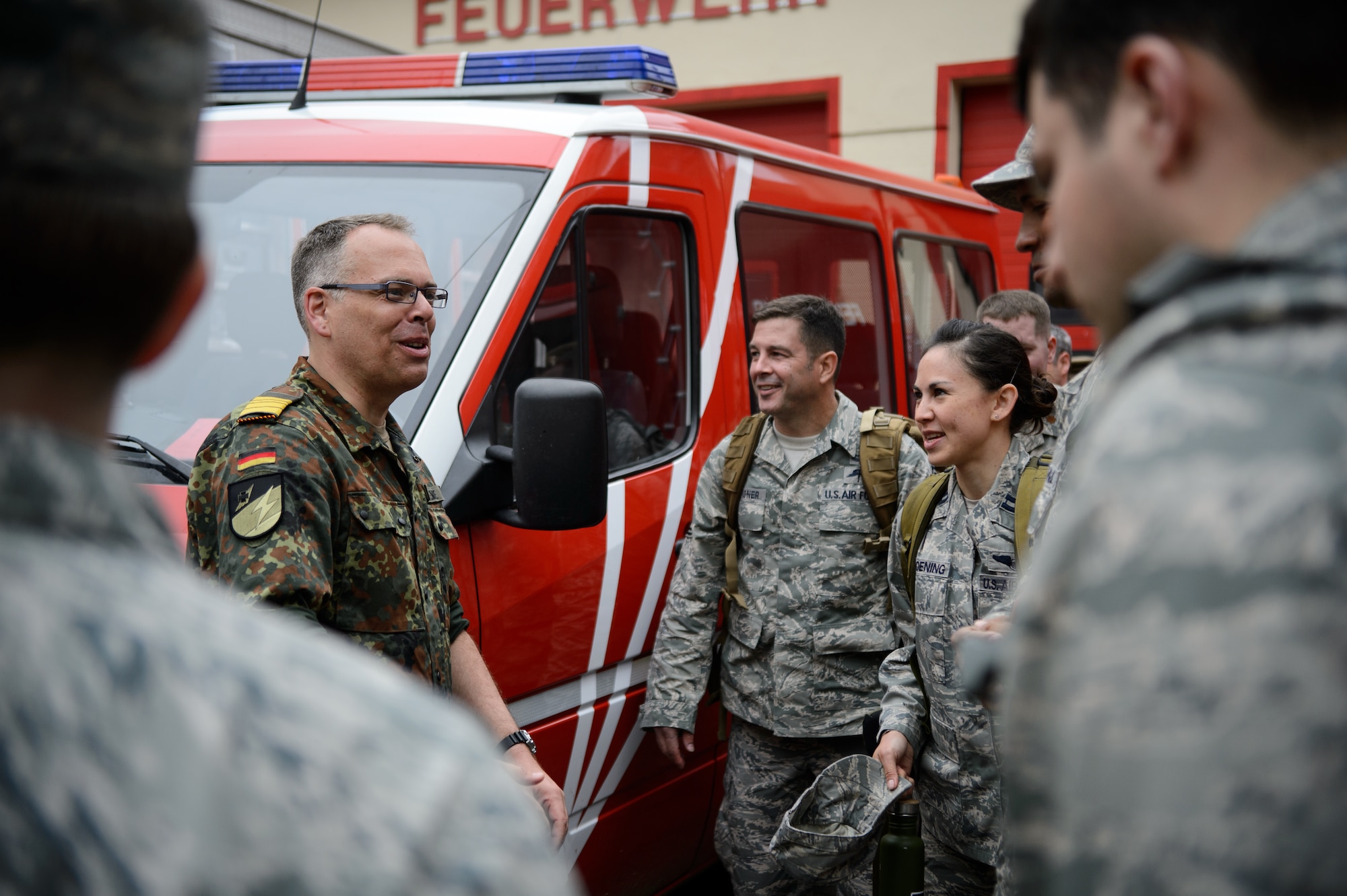 Cmdr. Juergen Lemke, Rhineland-Pfalz Reservist Chapter Undenheim chairman, speaks to Airmen from the 4th Air Support Operations Group after completing a 12-kilometer ruck march May 1, 2015, at Undenheim, Germany. Ten Airmen joined the Rhineland-Pfalz Reservist in one of many events designed to build relationships and develop an understanding of each other. (U.S. Air Force photo/Staff Sgt. Armando A. Schwier-Morales)