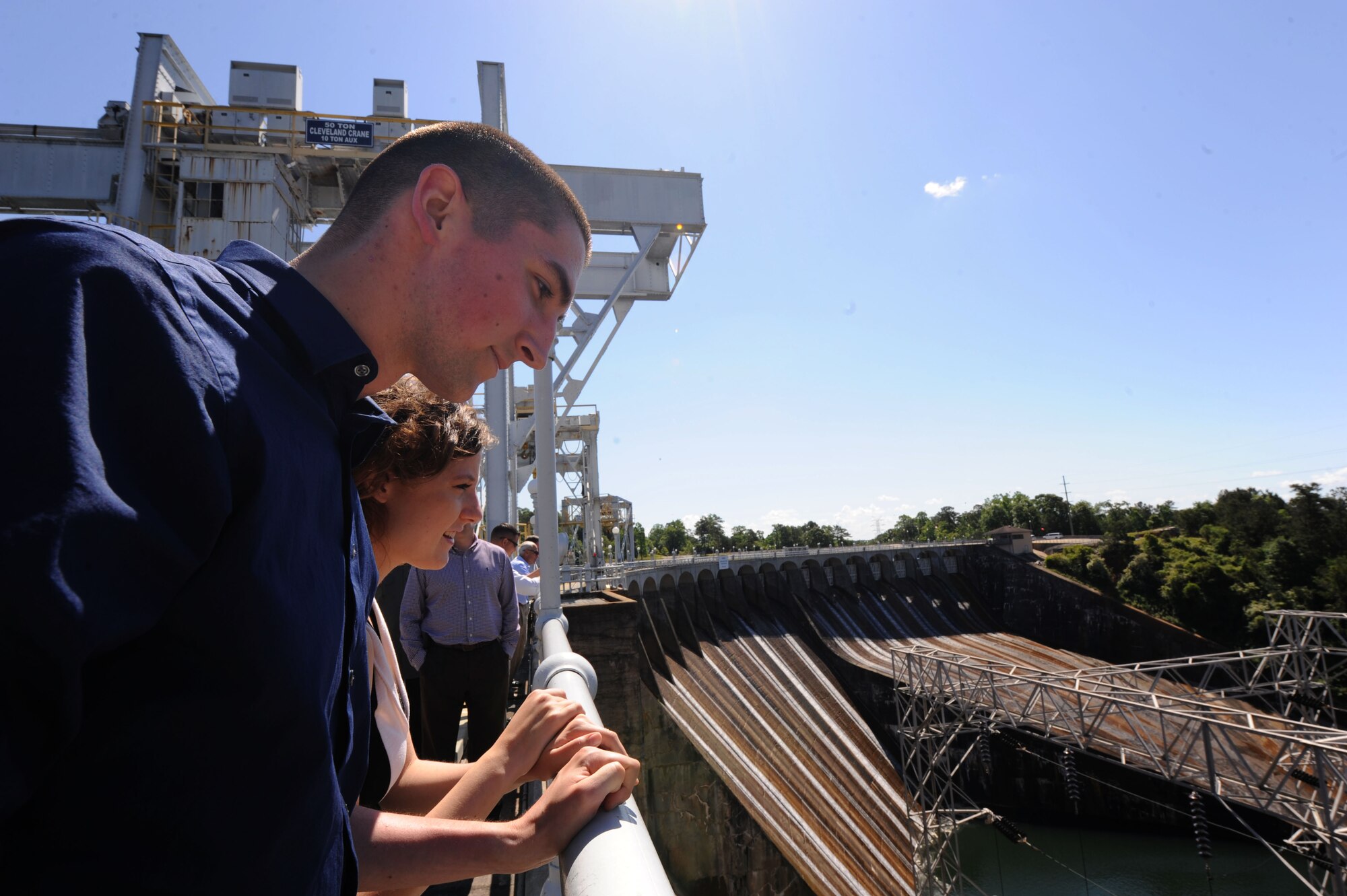 Senior Airman Vincent Glenn-Stone, Air Education and Training Command’s 2015 12 Outstanding Honor Guard Airman of the Year Award recipient from Maxwell Air Force Base, peers over Martin Dam located near Dadeville, Alabama, in the counties of Elmore and Tallapoosa, May 6, 2015. Glenn-Stone and Maxwell’s other two OAY recipients toured the dam with their families as part of a weeklong celebration of the Airmen winning the awards. The Alabama Power Company began construction of the dam in 1916 and now generates 327 million kilowatts of power a year. (U.S. Air Force photo by Airman 1st Class Alexa Culbert/Cleared)