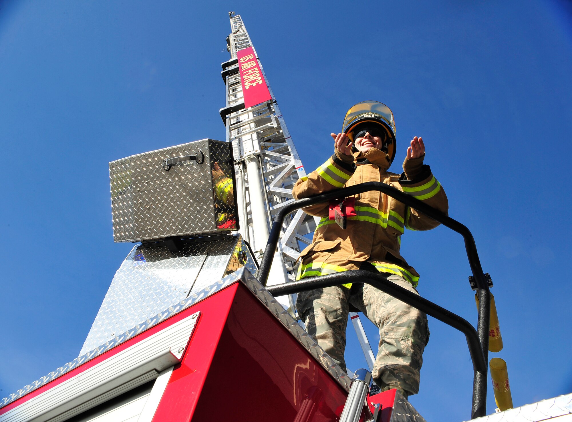 Senior Airman Mark Morris, 86th Civil Engineer Squadron fire truck operator, answers Ramstein Middle and High School students’ questions during Job Shadow Day May 8, 2015, at Ramstein Air Base, Germany. Students had the opportunity to learn about the different careers the Air Force has to offer by touring facilities and receiving hands-on lessons. (U.S. Air Force photo/ Airman 1st Class Larissa Greatwood)