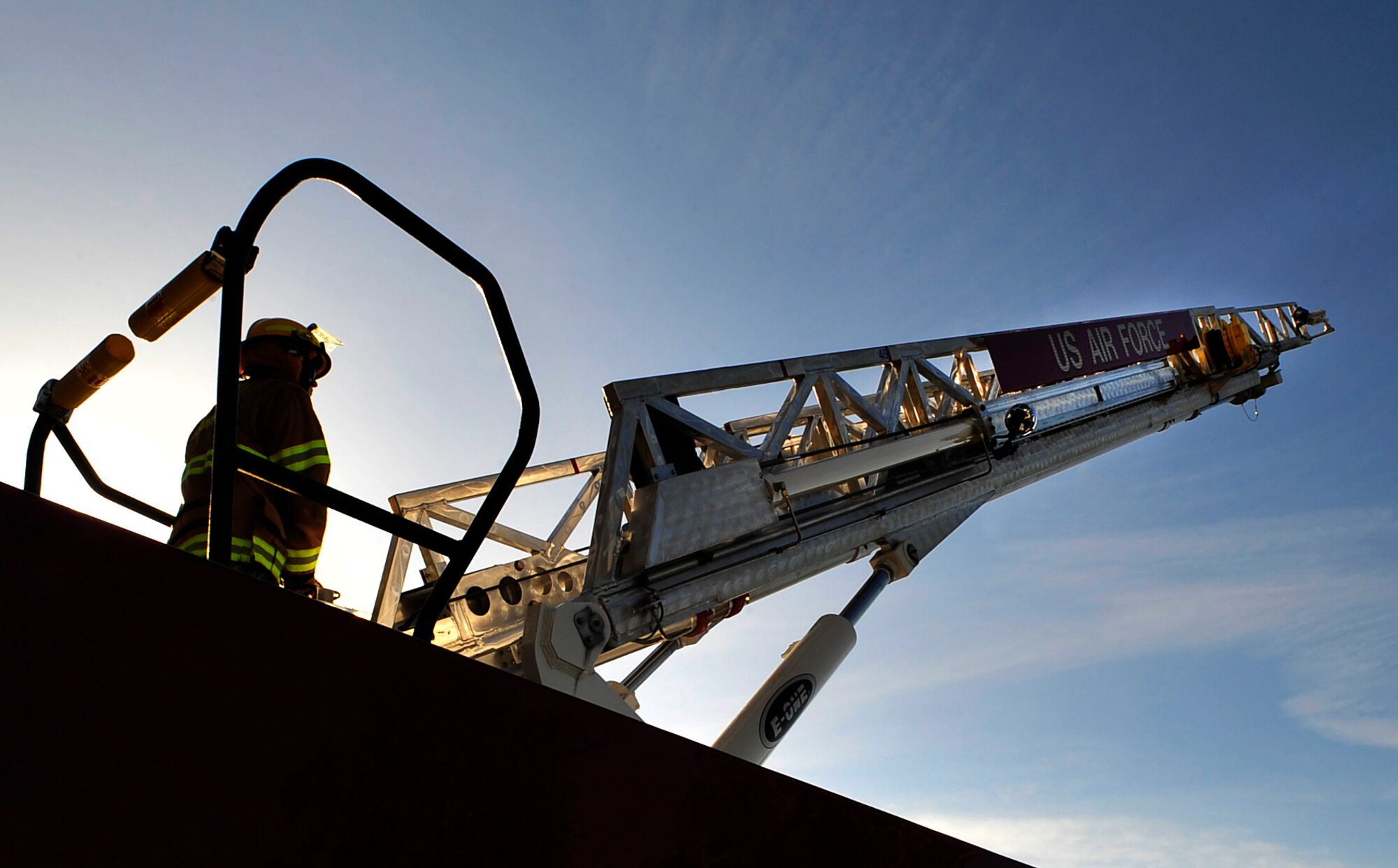 Senior Airman Mark Morris, 86th Civil Engineer Squadron fire truck operator, demonstrates how firefighters maneuver a fire truck’s ladder in the event of an emergency during Job Shadow Day May 8, 2015, at Ramstein Air Base, Germany. The 86th CES firefighters train with partner nations to enhance their skills for real-world emergencies. (U.S. Air Force photo/Airman 1st Class Larissa Greatwood) 