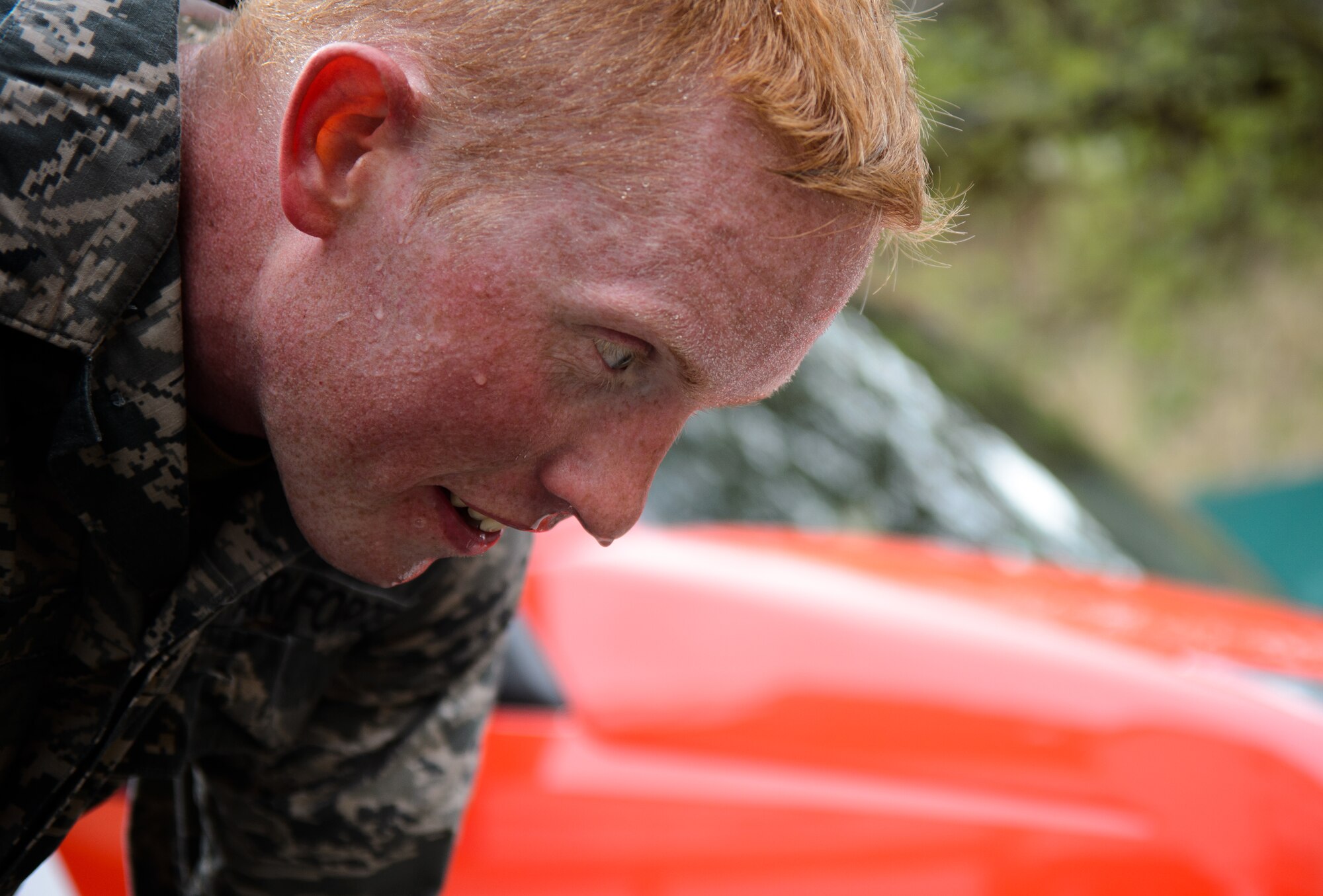 Staff Sgt. Maximilian McPhee, 4th Air Support Operations Group material management NCO in charge, takes a breath after completing a 12-kilometer ruck march in less than 1 hour and 40 minutes May 1, 2015, at Undenheim, Germany. McPhee and nine other Airmen joined the Rhineland-Pfalz Reservist Chapter Undenheim in one of many events to earn a German Armed Forces Badge for Military Proficiency while building relationships. (U.S. Air Force photo/Staff Sgt. Armando A. Schwier-Morales)