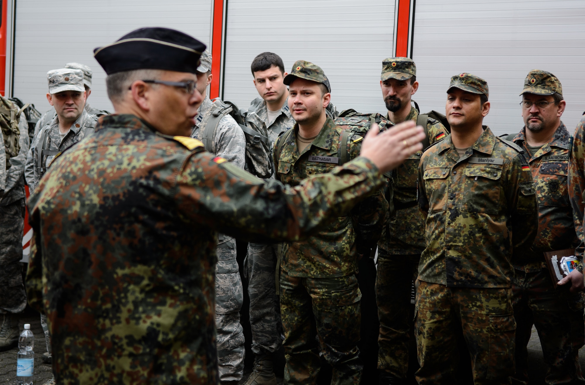 Cmdr. Juergen Lemke, Rhineland-Pfalz Reservist Chapter Undenheim chairman, briefs U.S. and German service members prior to a 12-kilometer ruck march May 1, 2015, at Undenheim, Germany. The Rhineland-Pfalz Reservist hosted 10 Airmen from the 4th Air Support Operations Group in the third of many joint events designed to foster relationships between the two militaries. (U.S. Air Force photo/Staff Sgt. Armando A. Schwier-Morales)