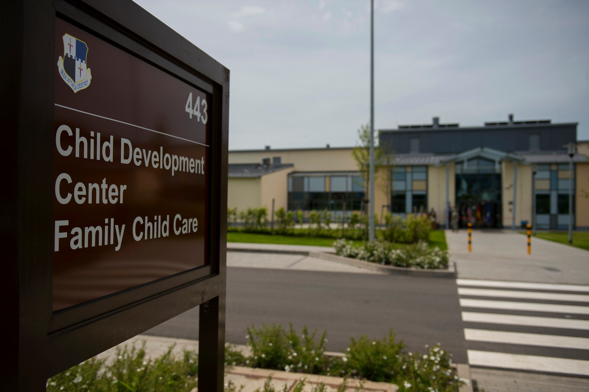 The sign for the new child development center stands outside the facility during its official opening at Spangdahlem Air Base, Germany, May 11, 2015. The $12.7 million building took nearly two years to construct. (U.S. Air Force photo by Airman 1st Class Luke Kitterman/Released)