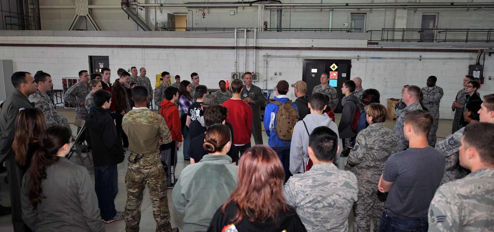 U.S. Air Force Col. David Cox, 100th Air Refueling Wing vice commander, speaks to Team Mildenhall Airmen and children during Job Shadow Day May 4, 2015, on RAF Mildenhall, England. The day allowed children to experience and learn about different careers in the Air Force. (U.S. Air Force photo by Airman 1st Class Kyla Gifford/Released)