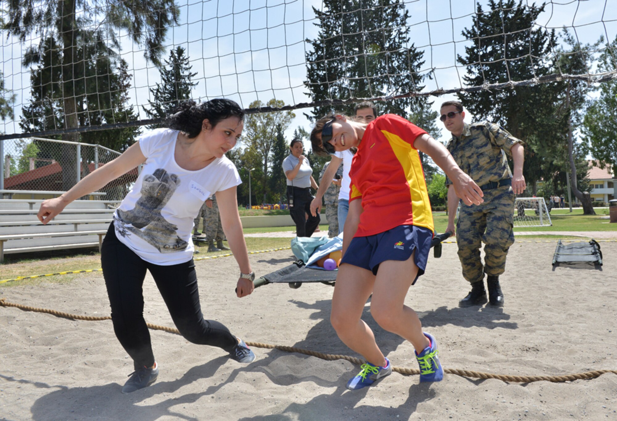 Participants of the 2015 Medical Rodeo carry a medical litter May 8, 2015, at Incirlik Air Base, Turkey. Each team in the event was comprised of one member from the U.S. and Turkish air forces, a Spanish service member and nurses and technicians from the local community. (U.S. Air Force photo by Senior Airman Michael Battles/Released)