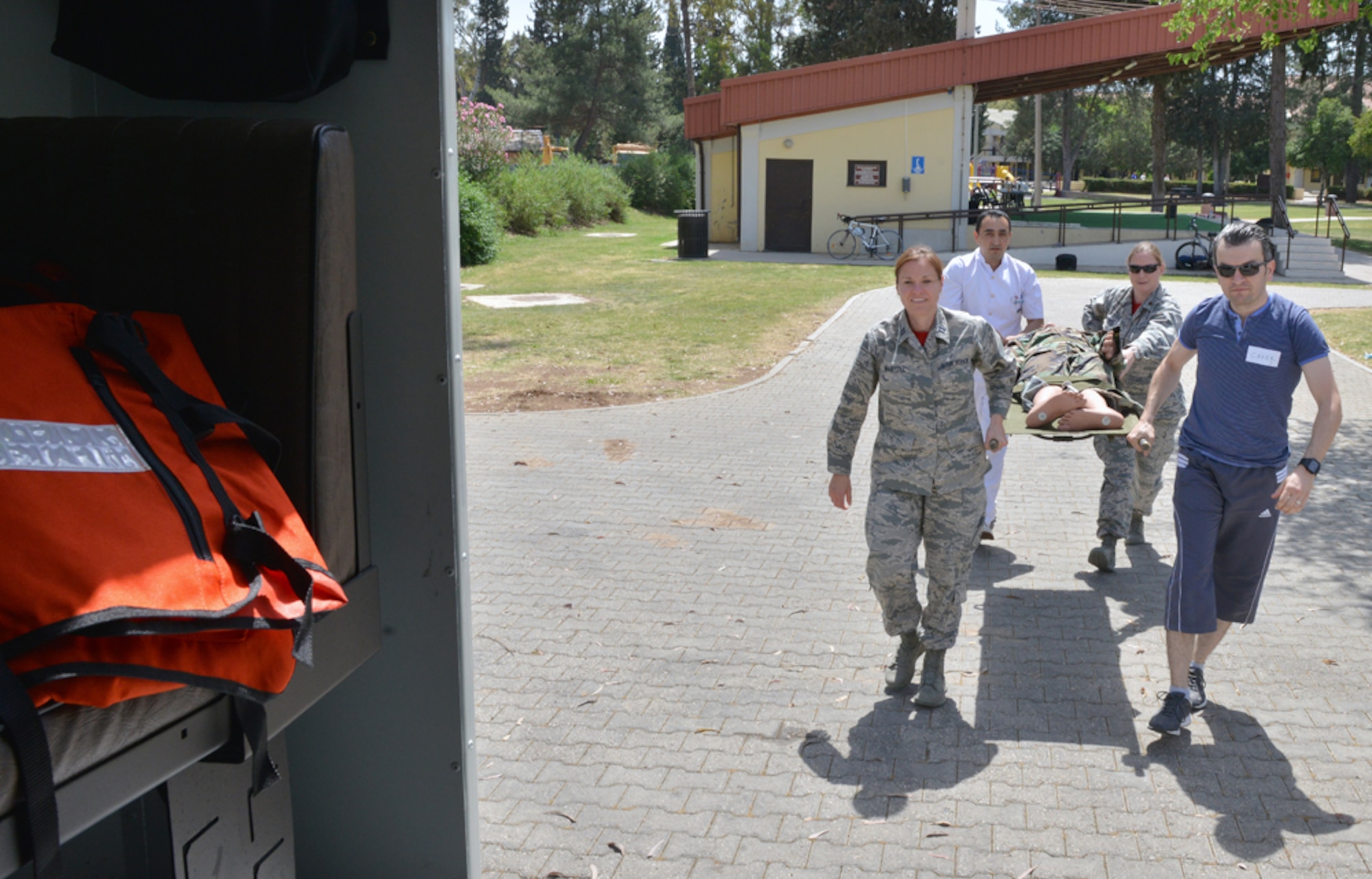 Capt. Leslie Martell, 39th Medical Support Squadron systems flight commander, guides her team during a patient lift part of the 2015 Medical Rodeo May 8, 2015, at Incirlik Air Base, Turkey.  The event, which was comprised of U.S. and Turkish air forces, Spanish service members and nurses and technicians from the local community, was held in honor of 2015 Nurse and Medical Technician Appreciation Week. (U.S. Air Force photo by Senior Airman Michael Battles/Released)