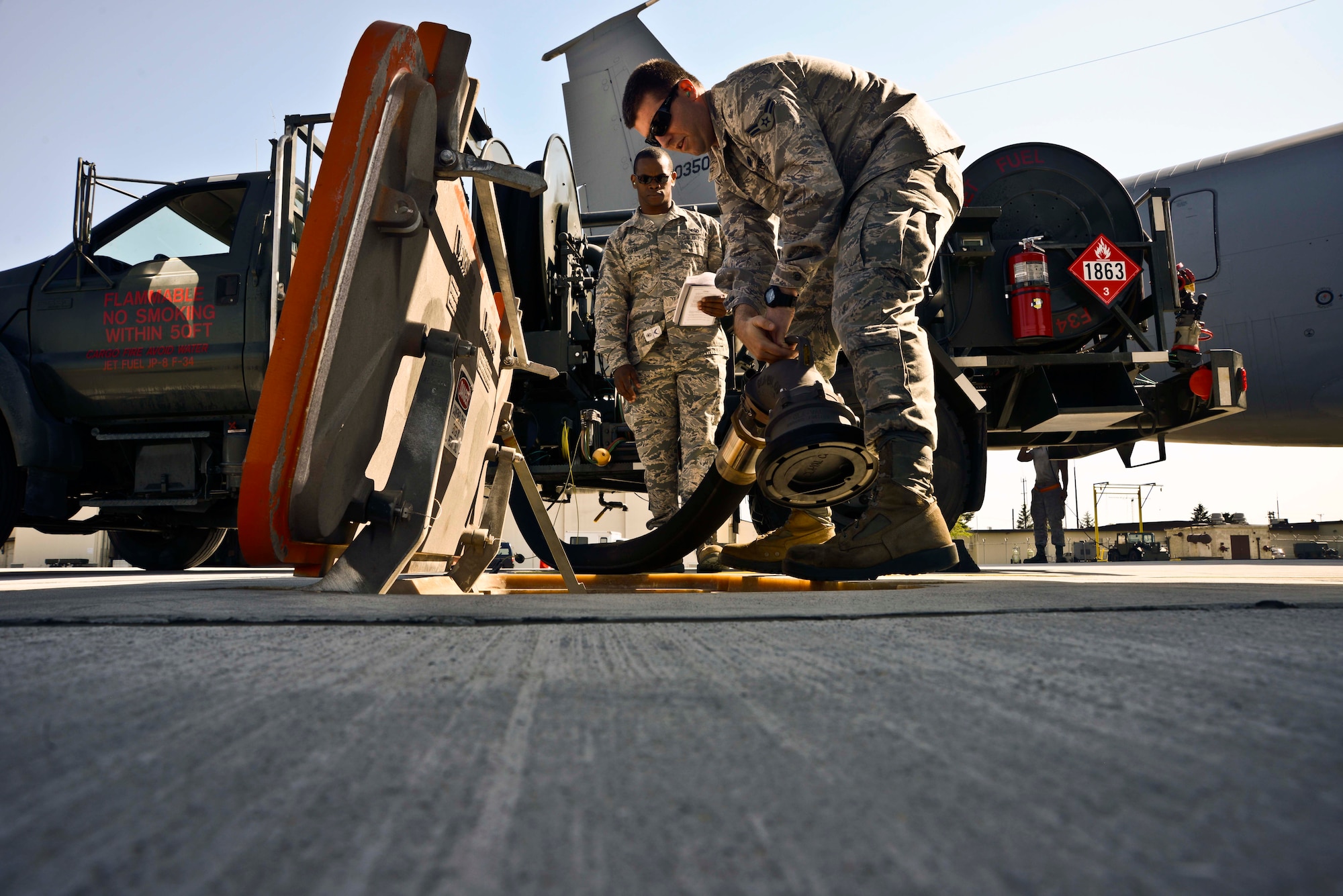 U.S Air Force Airman 1st Class David Works, 35th Logistics Readiness Squadron fuels distribution operator, hooks up a fuel hose to the newly installed Type III hydrant system at Misawa Air Base, Japan, May 11, 2015. Misawa hosted a ceremony recognizing the installation of the new system, which feeds fuel to aircraft from an underground tank. (U.S. Air Force photo by Staff Sgt. Derek VanHorn/Released)
