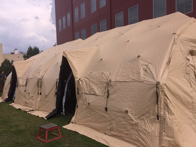 Tents such as these were erected for people to sleep in if they had lost their 
homes or their houses were too badly damaged to stay in following the 7.8 
magnitude earthquake that damaged many parts of the country.  (Courtesy photo)
