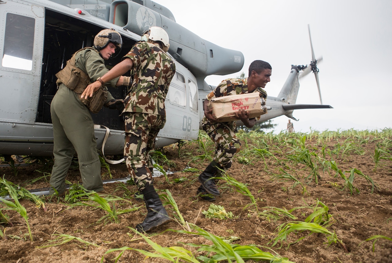 Nepali soldiers unload aid and relief supplies delivered by a U.S. Marine Corps UH-1Y Venom helicopter assigned to Joint Task Force 505 in Nepal’s Kavrepalanchowk district May, 11, 2015, during Operation Sahayogi Haat. U.S. Marine Corps photo by Staff Sgt. Jeffrey D. Anderson