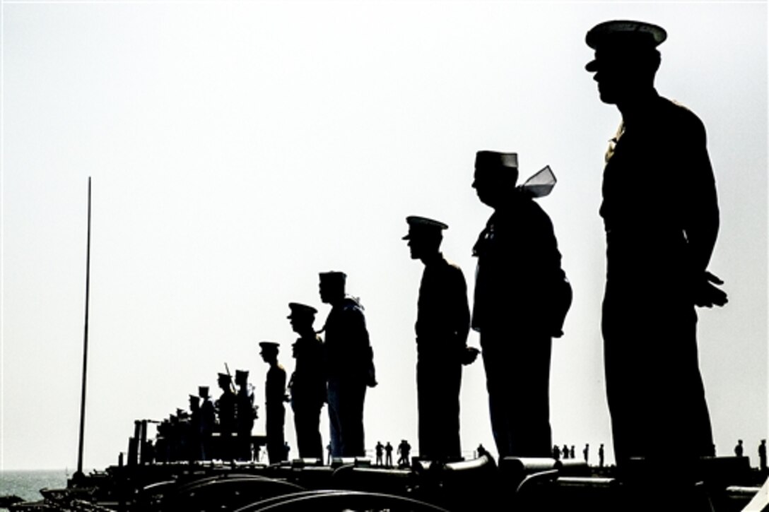 Marines and sailors man the rails aboard the USS Wasp as the ship departs from Port Everglades, Fla., May 10, 2015, at the end of the community’s Fleet Week 2015 celebration. The Marines are assigned to the 22nd Marine Expeditionary Unit. 