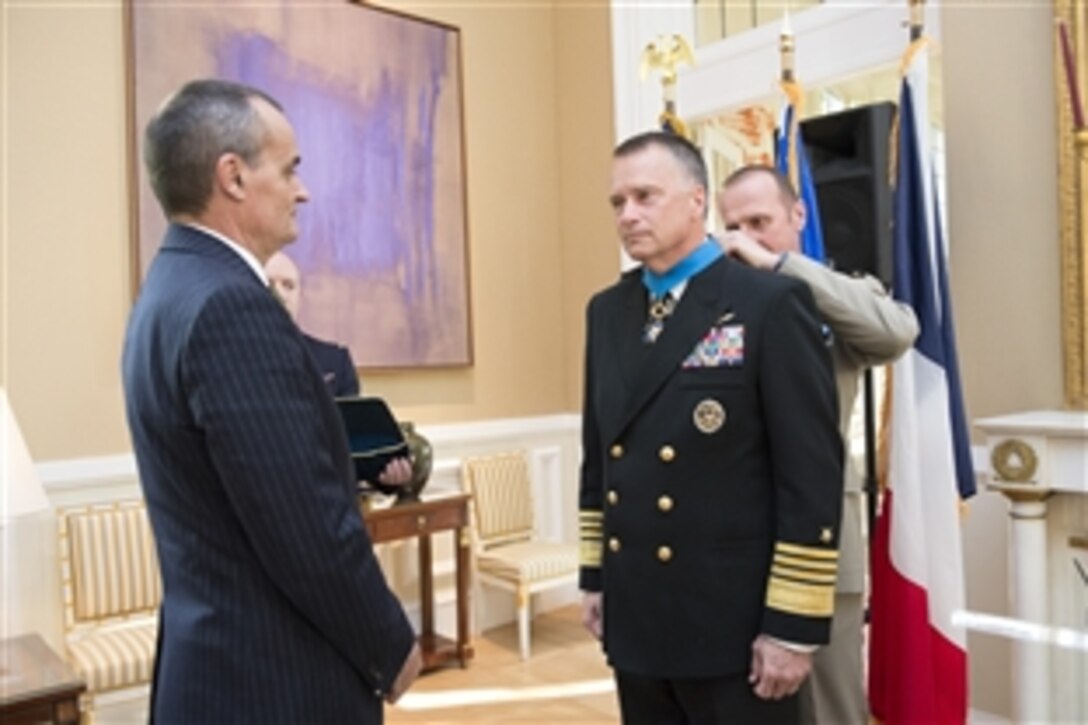 Gerard Araud, French ambassador to the United States, awards U.S. Navy Adm. James A. Winnefeld Jr., vice chairman of the Joint Chiefs of Staff, the National Order of Merit, commander class, in Washington, D.C., May 11, 2015. 