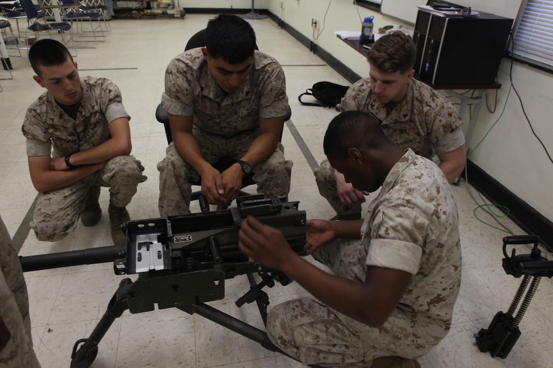 Lance Cpl. Trayon Bowleg, a light armored vehicle crewman with 2nd Light Armored Reconnaissance Battalion, 2nd Marine Division, disassembles a Mk-19 automatic grenade launcher during a Machine Gunners Course at the Division Combat Skills Center aboard Camp Lejeune, N.C., April 15, 2015. During the course the Marines were trained how to properly disassemble, reassemble and maintain the M249 squad automatic weapon, the M240B machine gun, Browning M2 .50 caliber machine gun and the MK19 automatic grenade launcher. (U.S. Marine Corps photo by Pfc. David N. Hersey/Released)