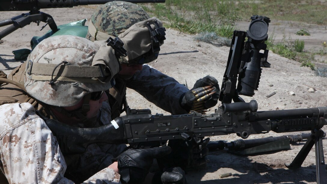 Marines with the Machine Gunner’s Course load an M240B medium machine gun during a live-fire exercise aboard Camp Lejeune, N.C., April 23, 2014. During the first week of the course the Marines spend a day on each of the machine guns, disassembling and assembling them, memorizing their nomenclature, their rate of fire and similar knowledge they would need to use should they be required to use one of the weapon systems in a combat situation.