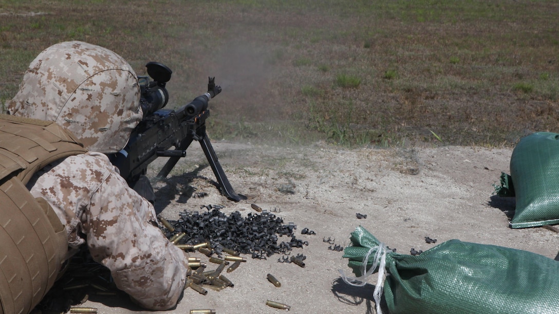 A Marine fires an M240B medium machine gun during the live-fire testing of the Machine Gunner’s Course aboard Camp Lejeune, N.C., April 23, 2014. The course is one of the services offered to Marines by the Division Combat Skills Center and is a two-week course that familiarizes Marines with the M249 squad automatic weapon light machine gun, M240B medium machine gun, M2 .50-caliber heavy machine gun and the MK-19 40mm automatic grenade launcher.