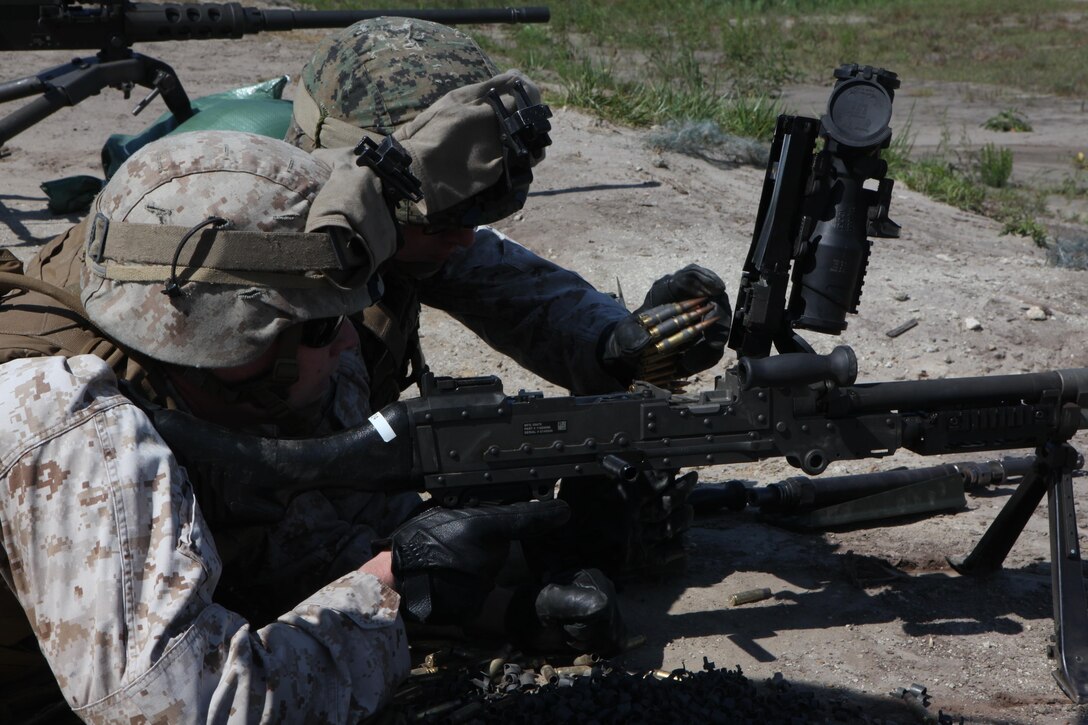 Marines with the Machine Gunner’s Course load an M240B medium machine gun during a live-fire exercise aboard Camp Lejeune, N.C., April 23, 2014. During the first week of the course the Marines spend a day on each of the machine guns, disassembling and assembling them, memorizing their nomenclature, their rate of fire and similar knowledge they would need to use should they be required to use one of the weapon systems in a combat situation. (U.S. Marine Corps photo by Pfc. David N. Hersey/Released)