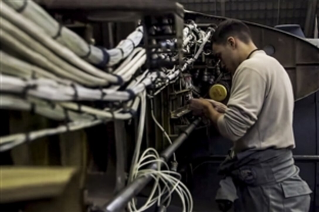 A U.S. airman helps rebuild the wings of a C-130 Hercules on Yokota Air Base, Japan. U.S. Air Force maintainers assigned to the 374th Aircraft Maintenance Squadron spent two months and roughly 5,000 hours completely rebuilding the aircraft’s wings.