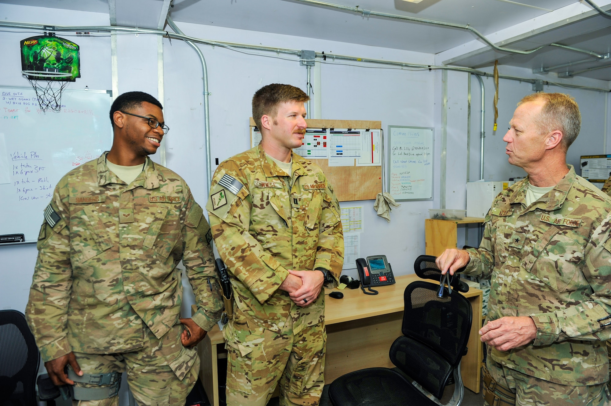 U.S. Air Force Brig. Gen. Mark D. Kelly, 455th Air Expeditionary Wing commander, talks with Airmen assigned to the 451st Air Expeditionary Group during a visit to Kandahar Airfield, Afghanistan, May 2, 2015.  The general along with Chief Master Sgt. Jeffery Brown, 455th AEW command chief, met with Airmen from across the group who provide intelligence, surveillance and reconnaissance, command and control, personnel recovery, and airborne datalink capabilities to commanders in the Afghanistan theater of operations. (U.S. Air Force photo by Maj. Tony Wickman/Released)