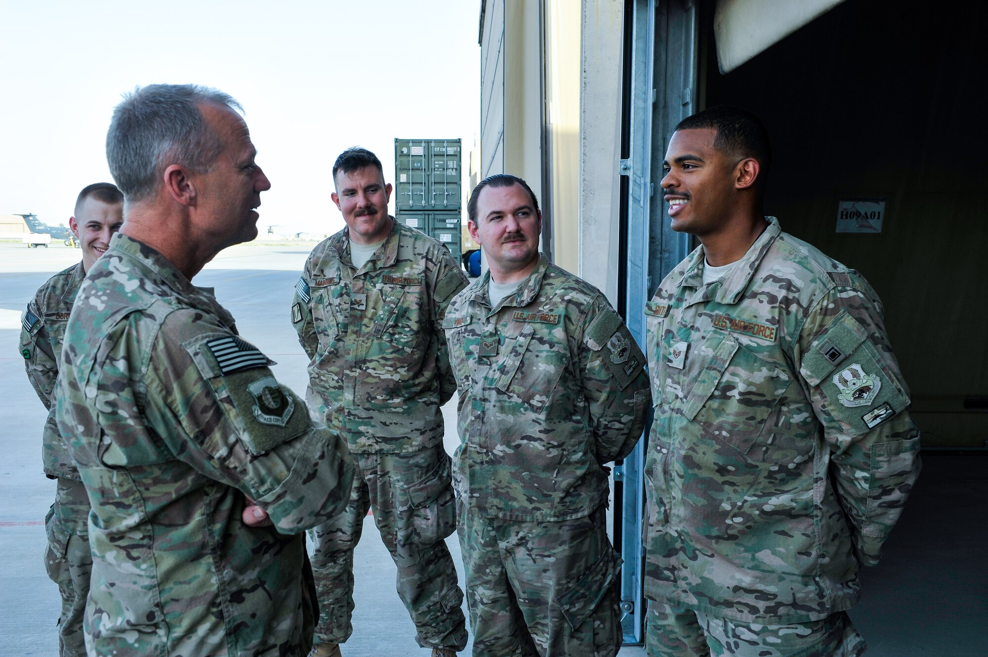 U.S. Air Force Brig. Gen. Mark D. Kelly, 455th Air Expeditionary Wing commander, talks with Airmen assigned to the 451st Air Expeditionary Group during a visit to Kandahar Airfield, Afghanistan, May 2, 2015.  The general along with Chief Master Sgt. Jeffery Brown, 455th AEW command chief, met with Airmen from across the group who provide intelligence, surveillance and reconnaissance, command and control, personnel recovery, and airborne datalink capabilities to commanders in the Afghanistan theater of operations. (U.S. Air Force photo by Maj. Tony Wickman/Released)