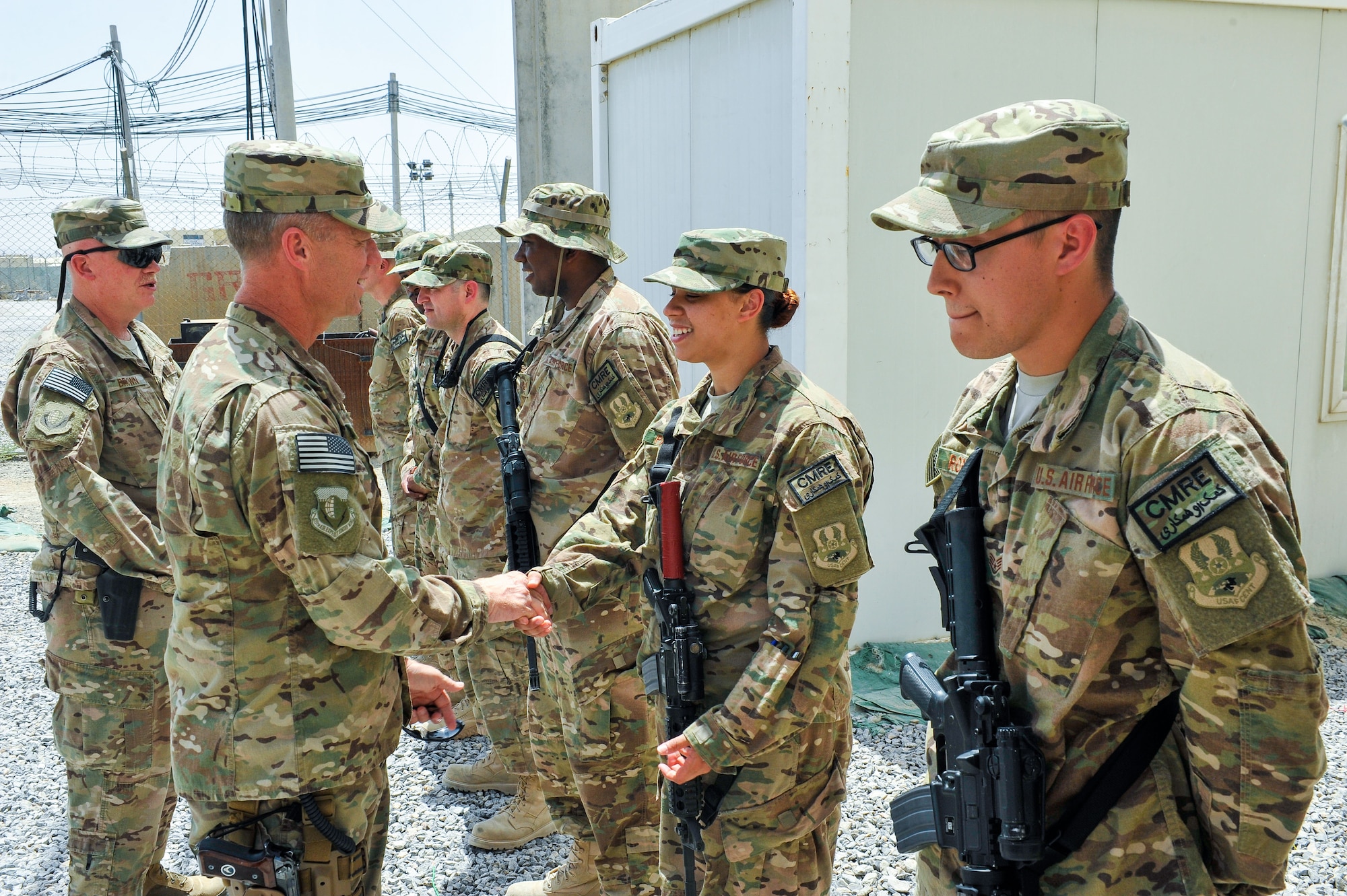 U.S. Air Force Brig. Gen. Mark D. Kelly, 455th Air Expeditionary Wing commander, and Chief Master Sgt. Jeffery Brown, 455th AEW command chief, meet with Airmen assigned to the 451st Air Expeditionary Group during a visit to Kandahar Airfield, Afghanistan, May 3, 2015.  The general along with the chief met with Airmen from across the group who provide intelligence, surveillance and reconnaissance, command and control, personnel recovery, and airborne datalink capabilities to commanders in the Afghanistan theater of operations. (U.S. Air Force photo by Maj. Tony Wickman/Released)