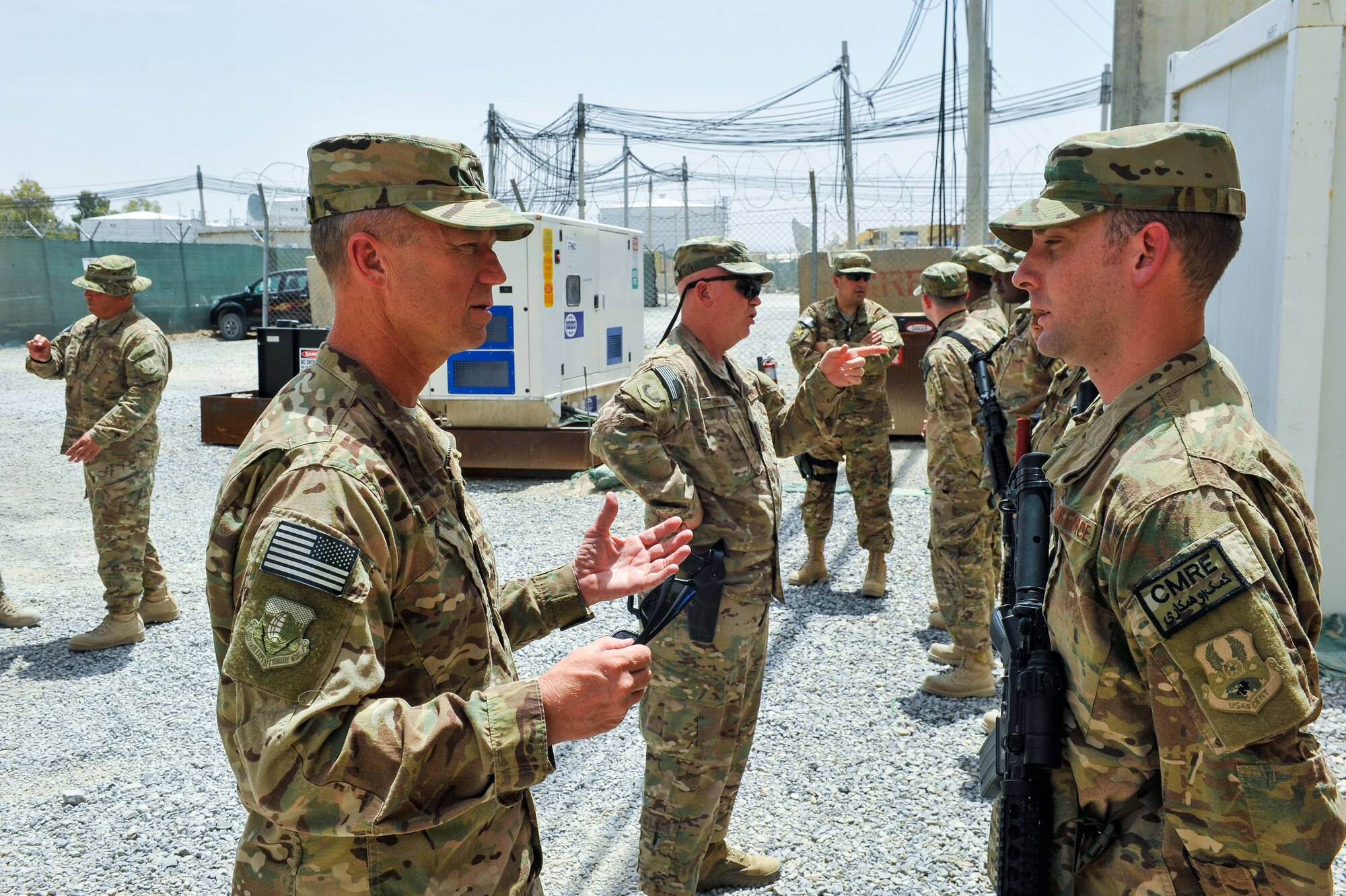 U.S. Air Force Brig. Gen. Mark D. Kelly, 455th Air Expeditionary Wing commander, and Chief Master Sgt. Jeffery Brown, 455th AEW command chief, meet with Airmen assigned to the 451st Air Expeditionary Group during a visit to Kandahar Airfield, Afghanistan, May 3, 2015.  The general along with the chief met with Airmen from across the group who provide intelligence, surveillance and reconnaissance, command and control, personnel recovery, and airborne datalink capabilities to commanders in the Afghanistan theater of operations. (U.S. Air Force photo by Maj. Tony Wickman/Released)