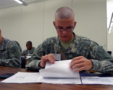 Pvt. Daniel James Sanchez of Apple Valley, Calif., studies algebraic equations to prepare for his upcoming GED examination at the National Guard GED Plus Program at Camp Robinson in North Little Rock, Ark., Nov. 3, 2010. Sanchez failed math in high school but with help from the GED Plus Tutors, he passed the math and algebra section and received his GED, Nov. 5, 2010.